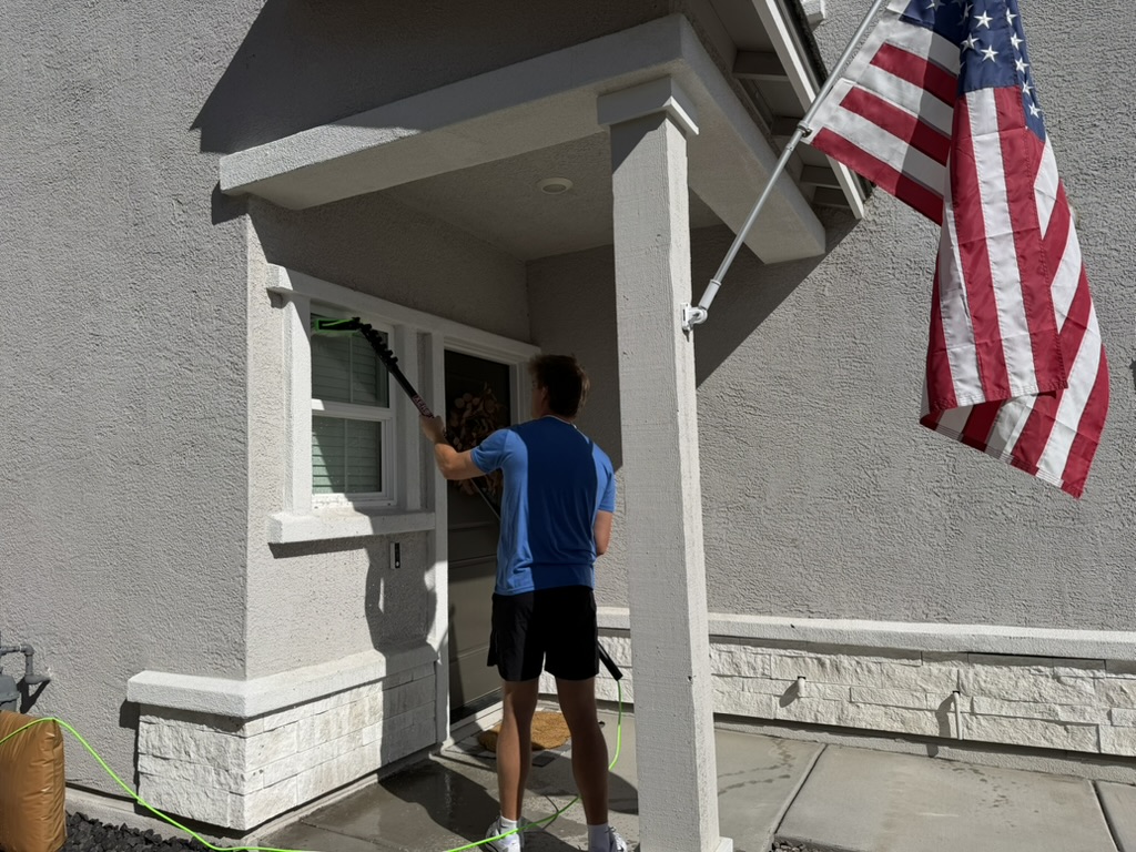 Window Pros crew cleaning front windows at a Sparks, NV home